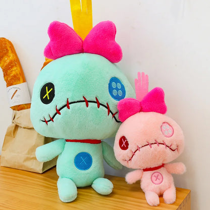Peluche Scrump verde y rosa
